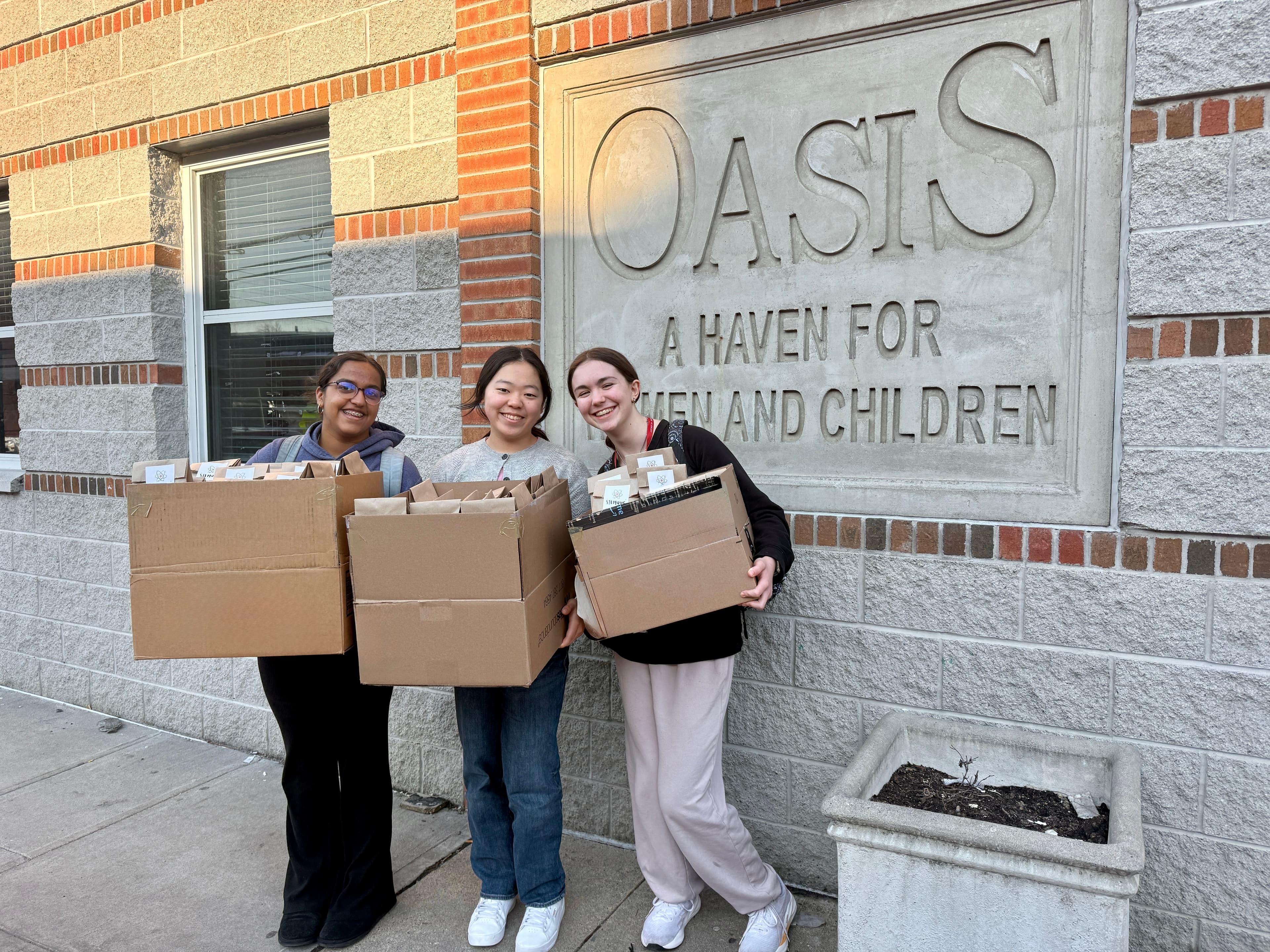 The STEMagic team with the kits donated to Oasis